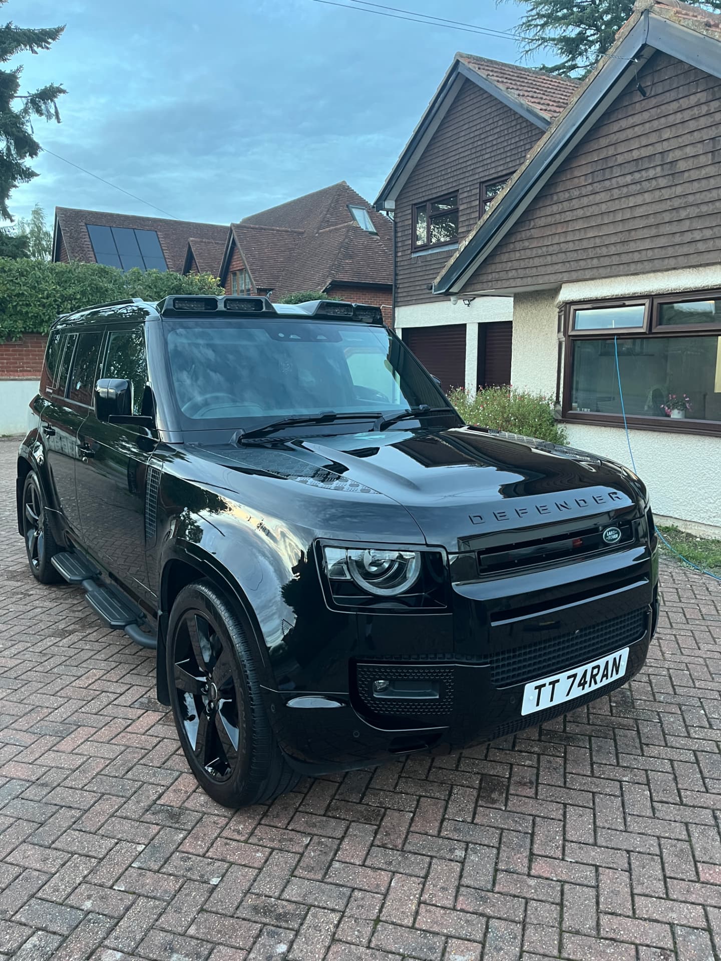 Black Land Rover Defender after a detail